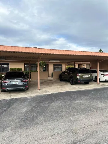 a kitchen with granite countertop white cabinets and stainless steel appliances