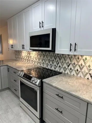 a bedroom with a bed and flat tv screen