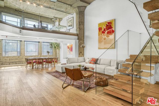 a view of a living room and kitchen