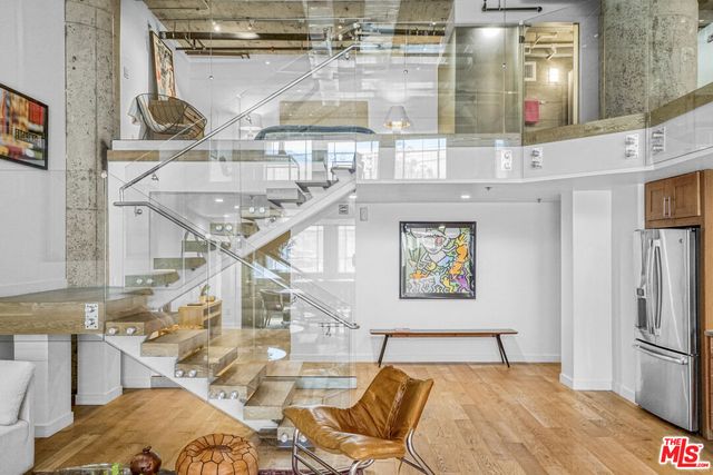 a living room filled with furniture window and wooden floor