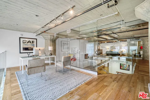 a bedroom with a bed and a sink