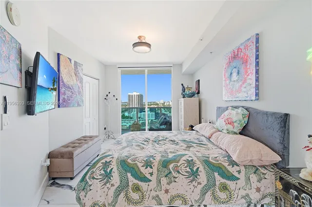 a living room filled with furniture and a chandelier