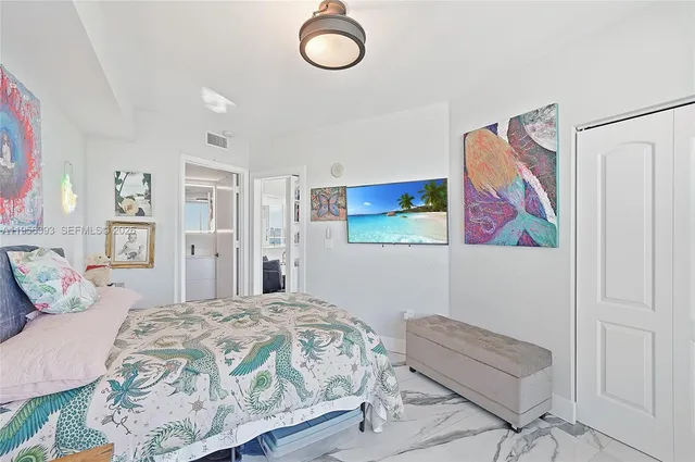 a kitchen with stainless steel appliances a refrigerator sink and cabinets