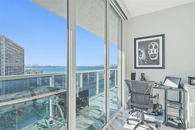 a view of a kitchen with furniture and windows