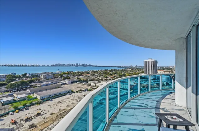 a view of a balcony with city