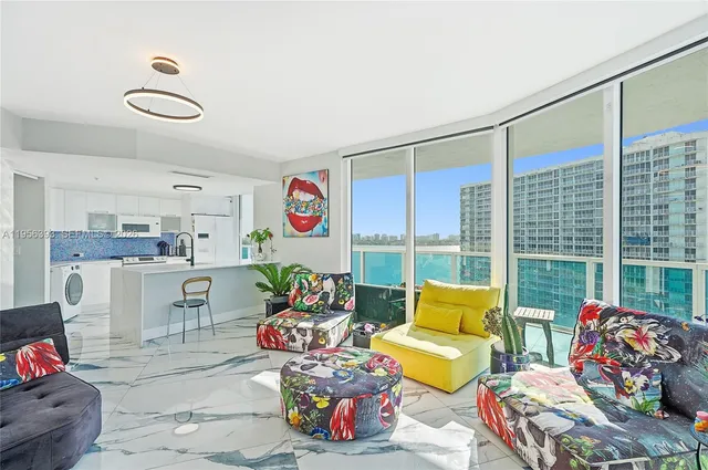 a bedroom with a bed and painting on the wall