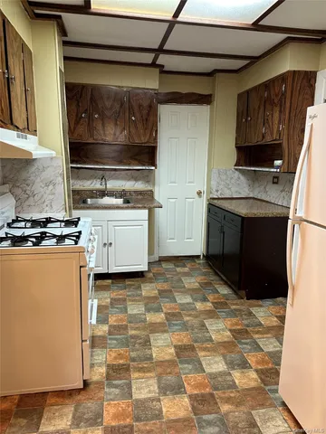 a kitchen with a stove and a microwave