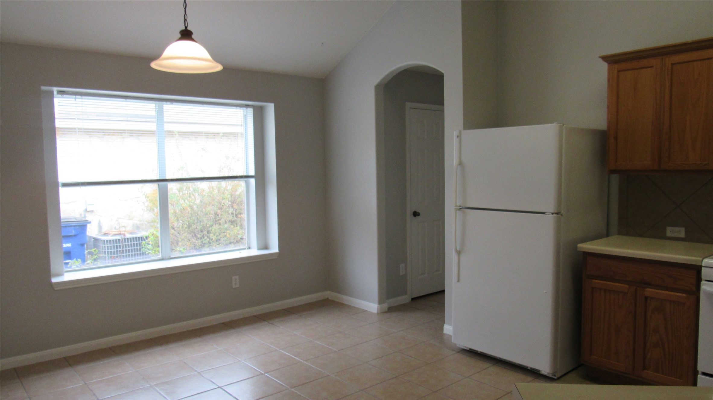 1510 Ridgewood Drive Leander, TX 78641 - Photo 4 of 19 a view of an empty room with a window