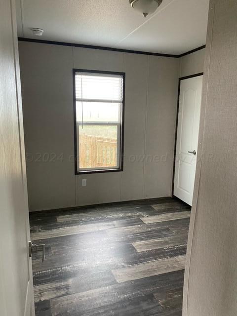 4100 Raef Road Amarillo, TX 79108 - Photo 12 of 16 a view of an empty room with a window