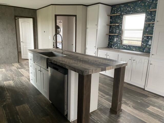 4100 Raef Road Amarillo, TX 79108 - Photo 3 of 16 a kitchen with a sink and a mirror