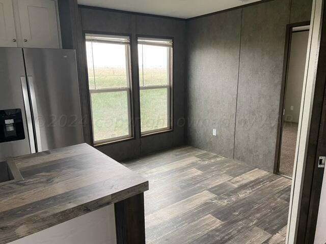 4100 Raef Road Amarillo, TX 79108 - Photo 4 of 16 a bedroom with a bed and a window