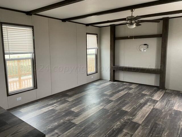 4100 Raef Road Amarillo, TX 79108 - Photo 5 of 16 an empty room with wooden floor and windows