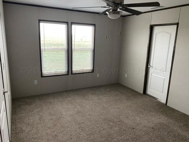4100 Raef Road Amarillo, TX 79108 - Photo 6 of 16 an empty room with a window