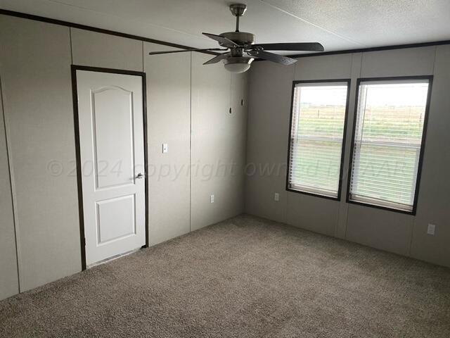 4100 Raef Road Amarillo, TX 79108 - Photo 7 of 16 an empty room with windows and closet