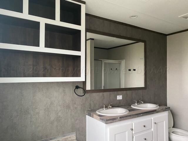 4100 Raef Road Amarillo, TX 79108 - Photo 8 of 16 a bathroom with a sink and a mirror