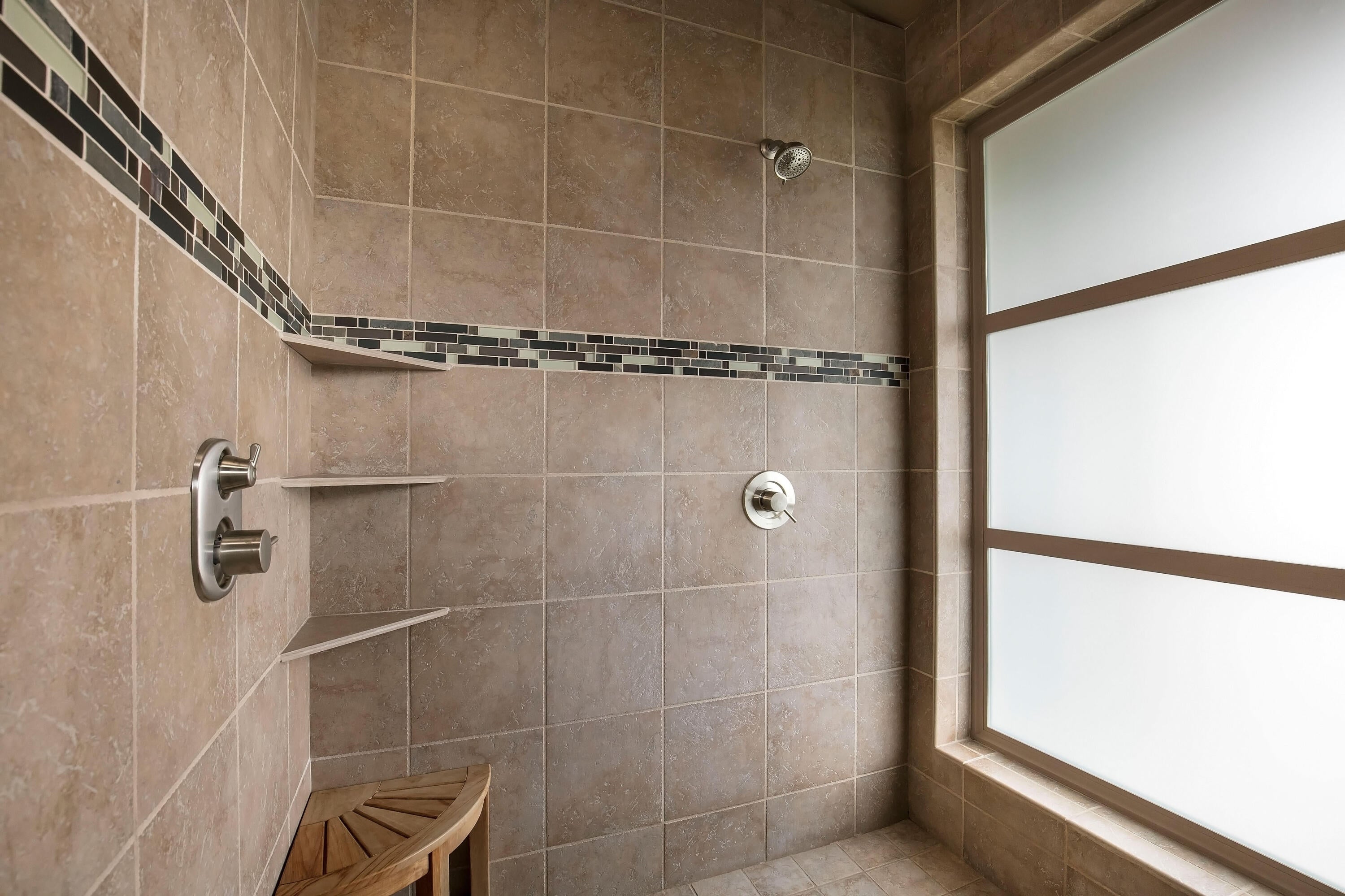 69015 Hurtley Ranch Road Sisters, OR 97759 - Photo 32 of 88 Primary bath walk-in tiled shower with 3 shower heads: rain shower, fixed, and hand held