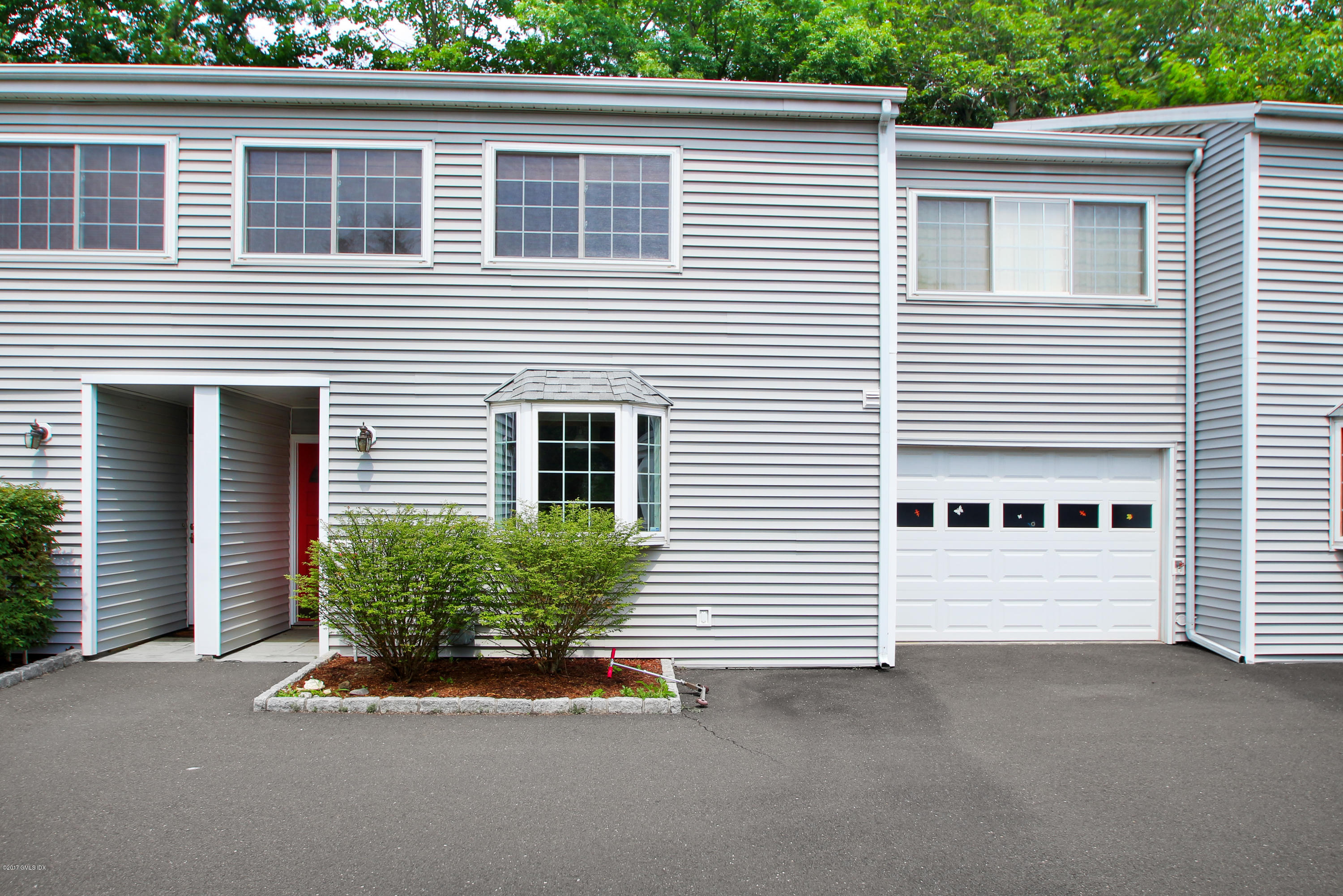 24 Decatur Street, Unit 2 Cos Cob, CT 06807 - Photo 1 of 19 a view of a house with a garage