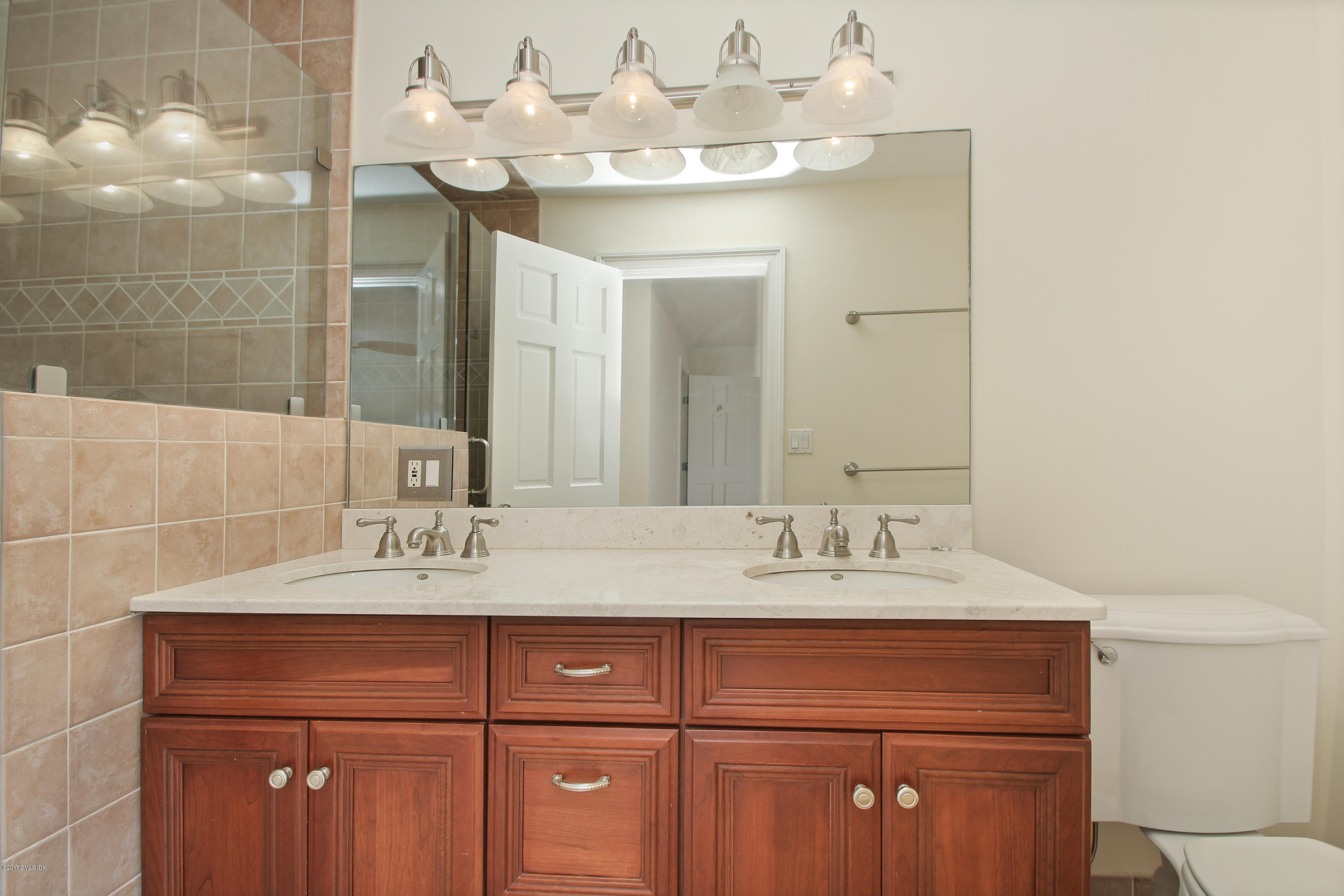 24 Decatur Street, Unit 2 Cos Cob, CT 06807 - Photo 11 of 19 a bathroom with a sink and a mirror