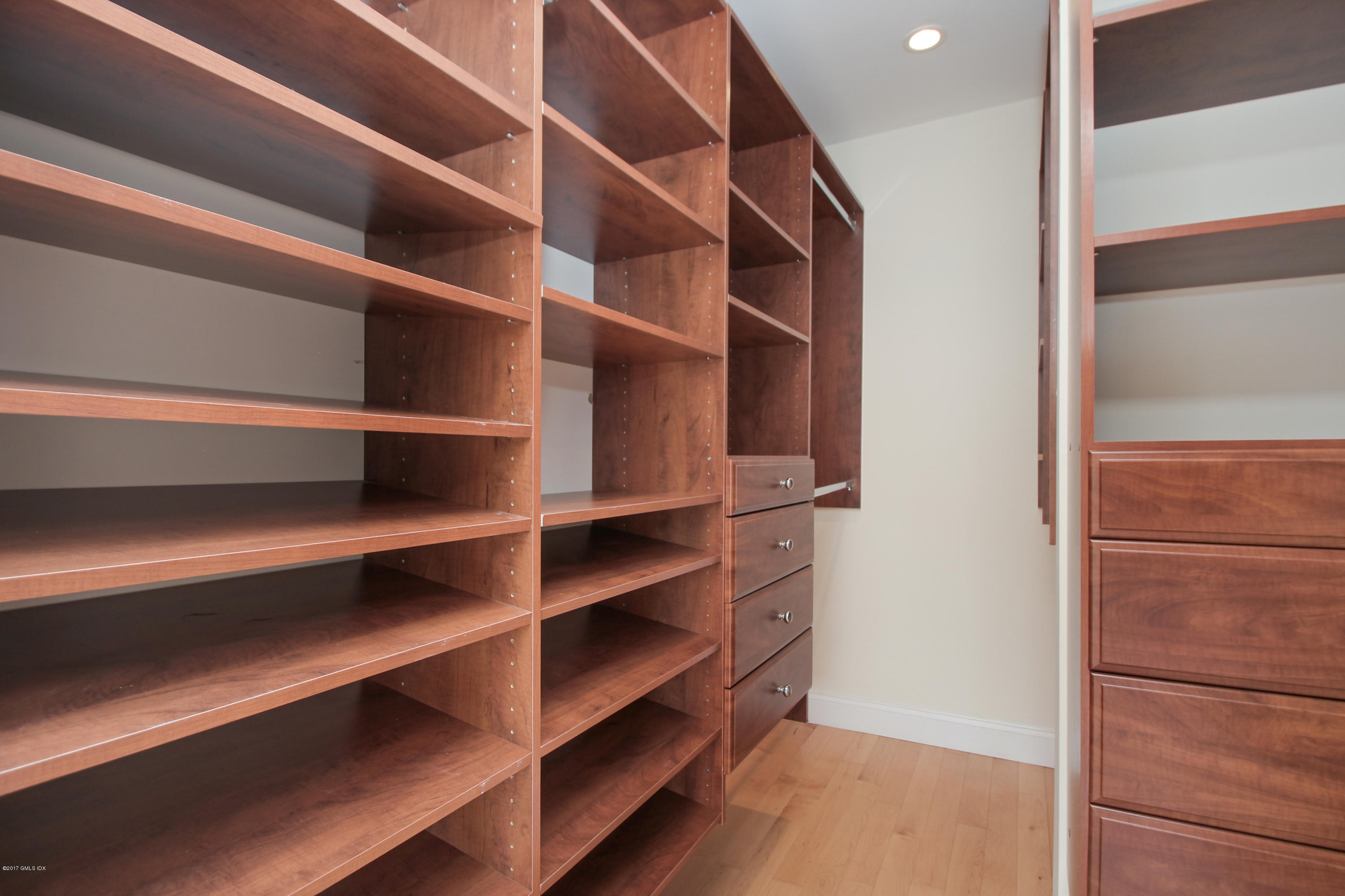 24 Decatur Street, Unit 2 Cos Cob, CT 06807 - Photo 12 of 19 a view of walk in closet with empty racks