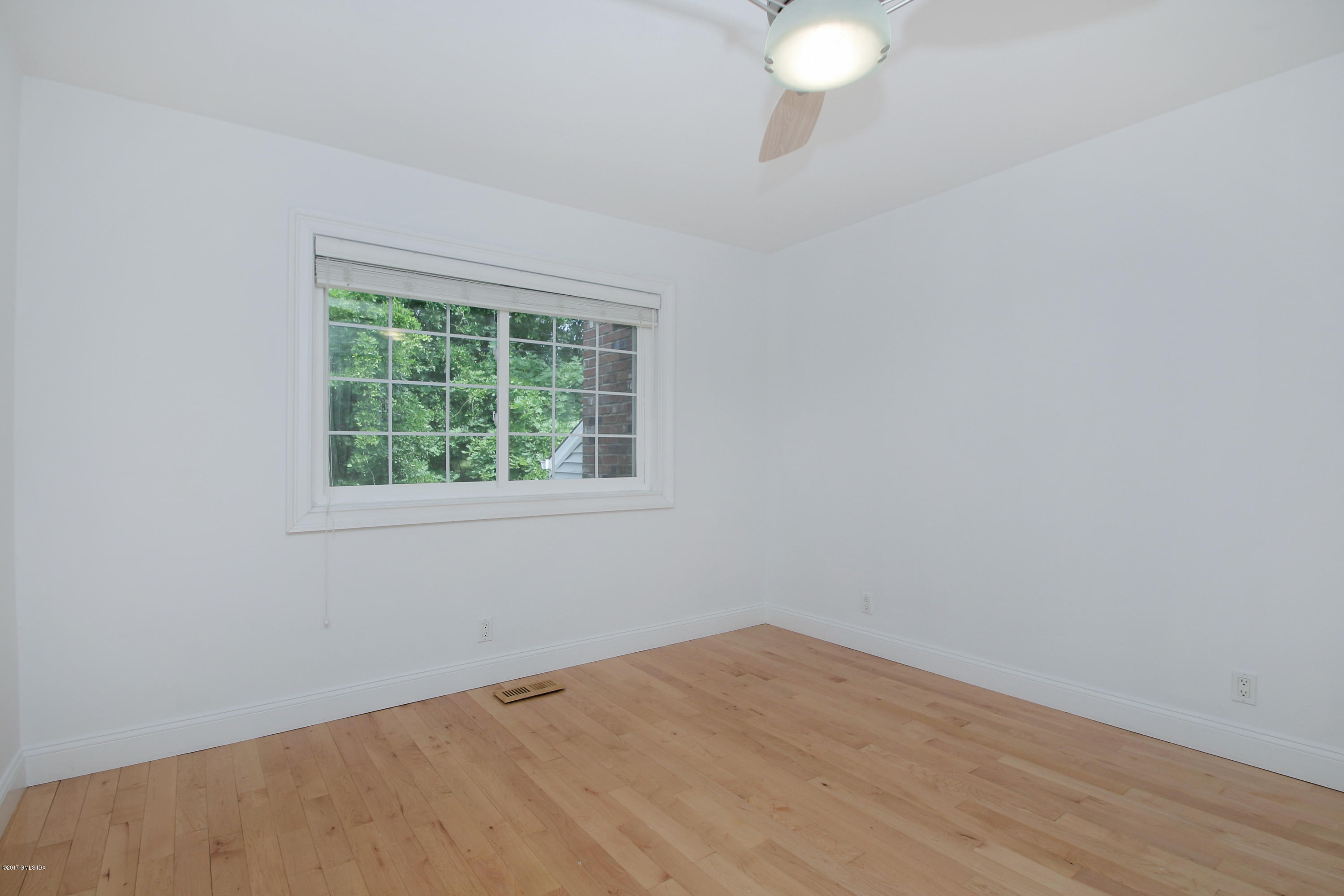 24 Decatur Street, Unit 2 Cos Cob, CT 06807 - Photo 13 of 19 an empty room with a window