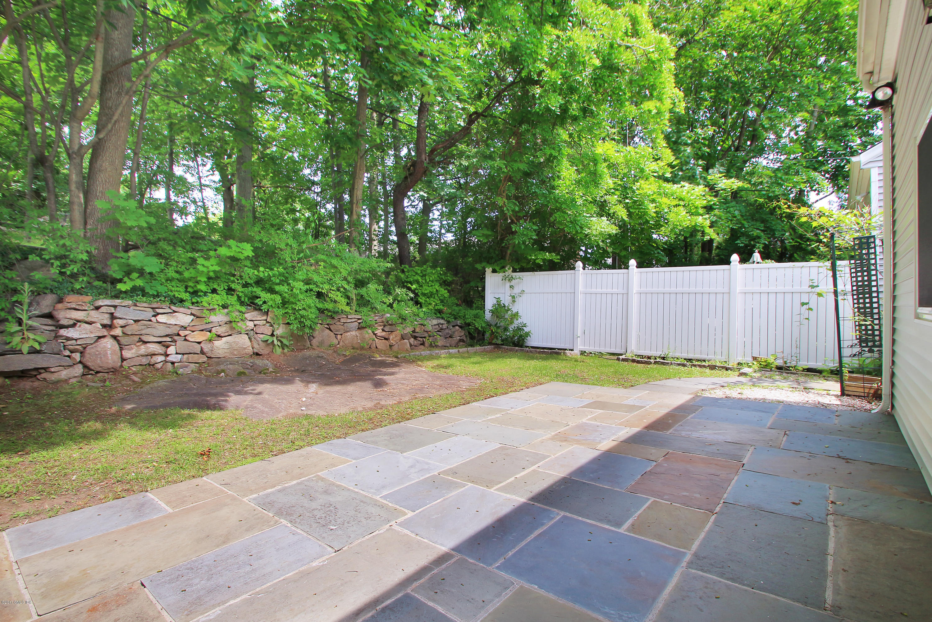 24 Decatur Street, Unit 2 Cos Cob, CT 06807 - Photo 15 of 19 a view of a backyard