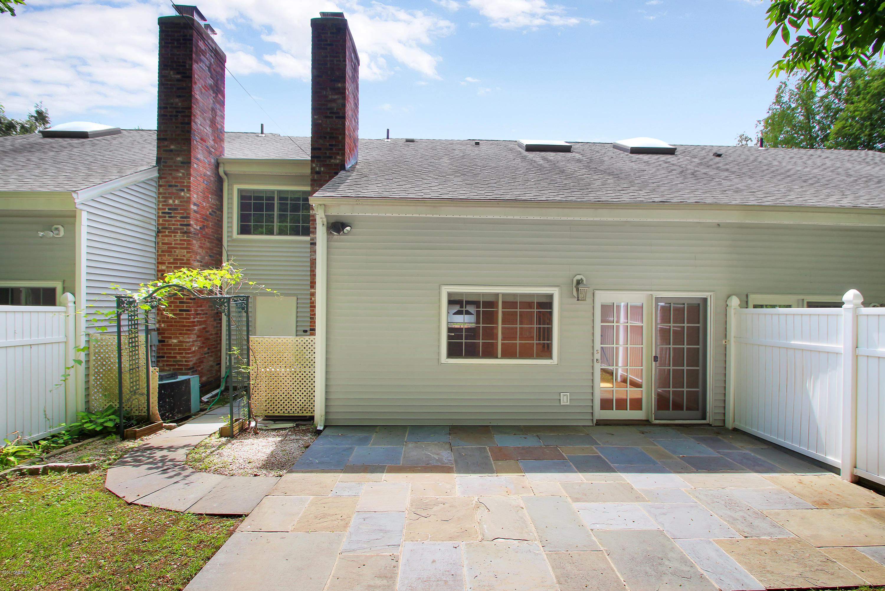 24 Decatur Street, Unit 2 Cos Cob, CT 06807 - Photo 16 of 19 a view of a house with backyard
