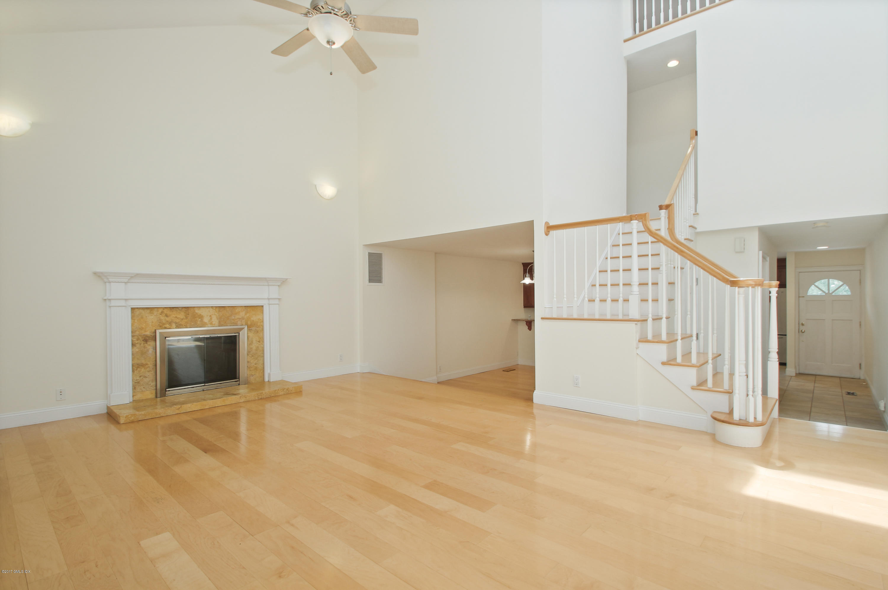 24 Decatur Street, Unit 2 Cos Cob, CT 06807 - Photo 3 of 19 a view of an empty room with a ceiling fan
