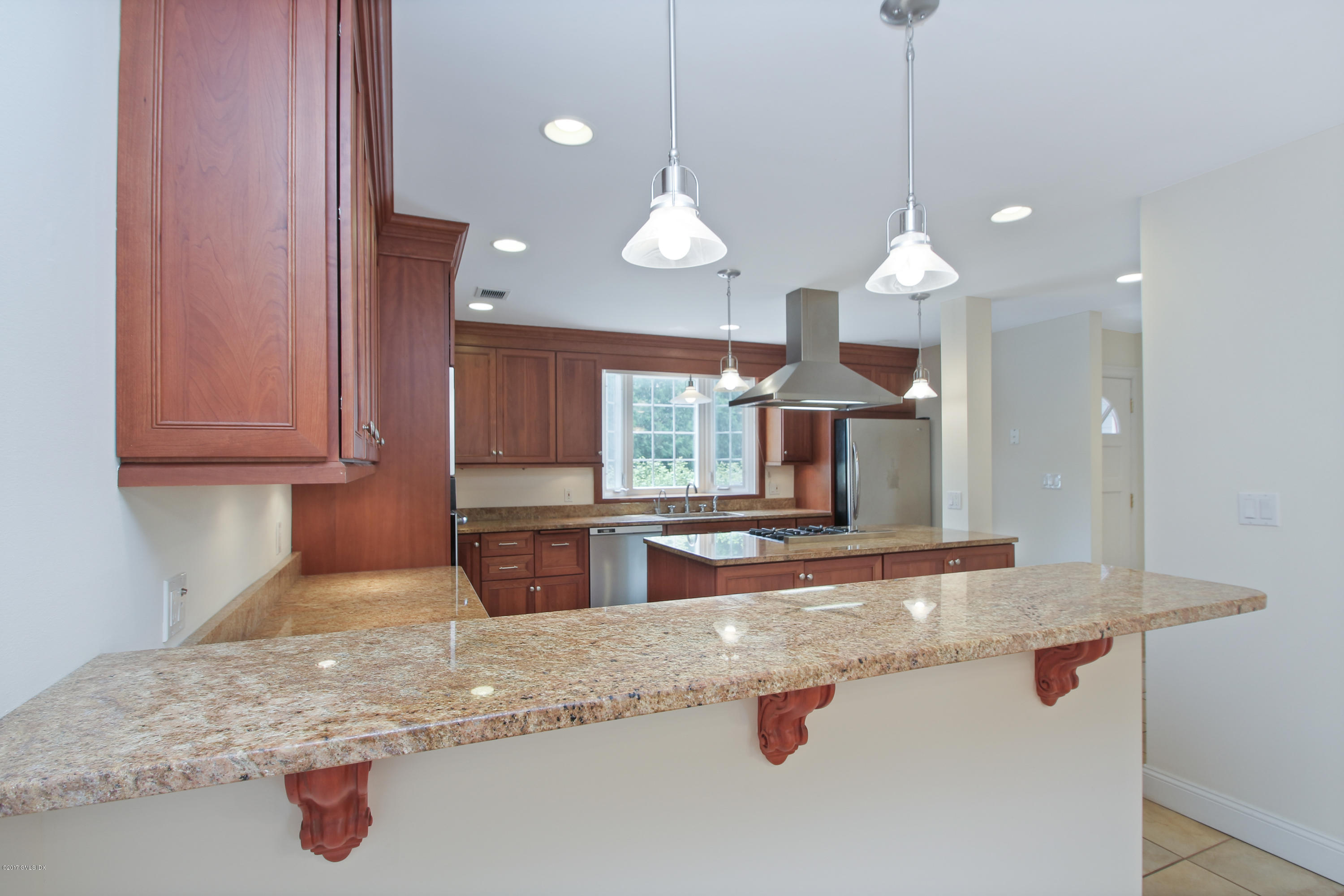24 Decatur Street, Unit 2 Cos Cob, CT 06807 - Photo 5 of 19 a kitchen with stainless steel appliances granite countertop a sink a stove and a wooden floors