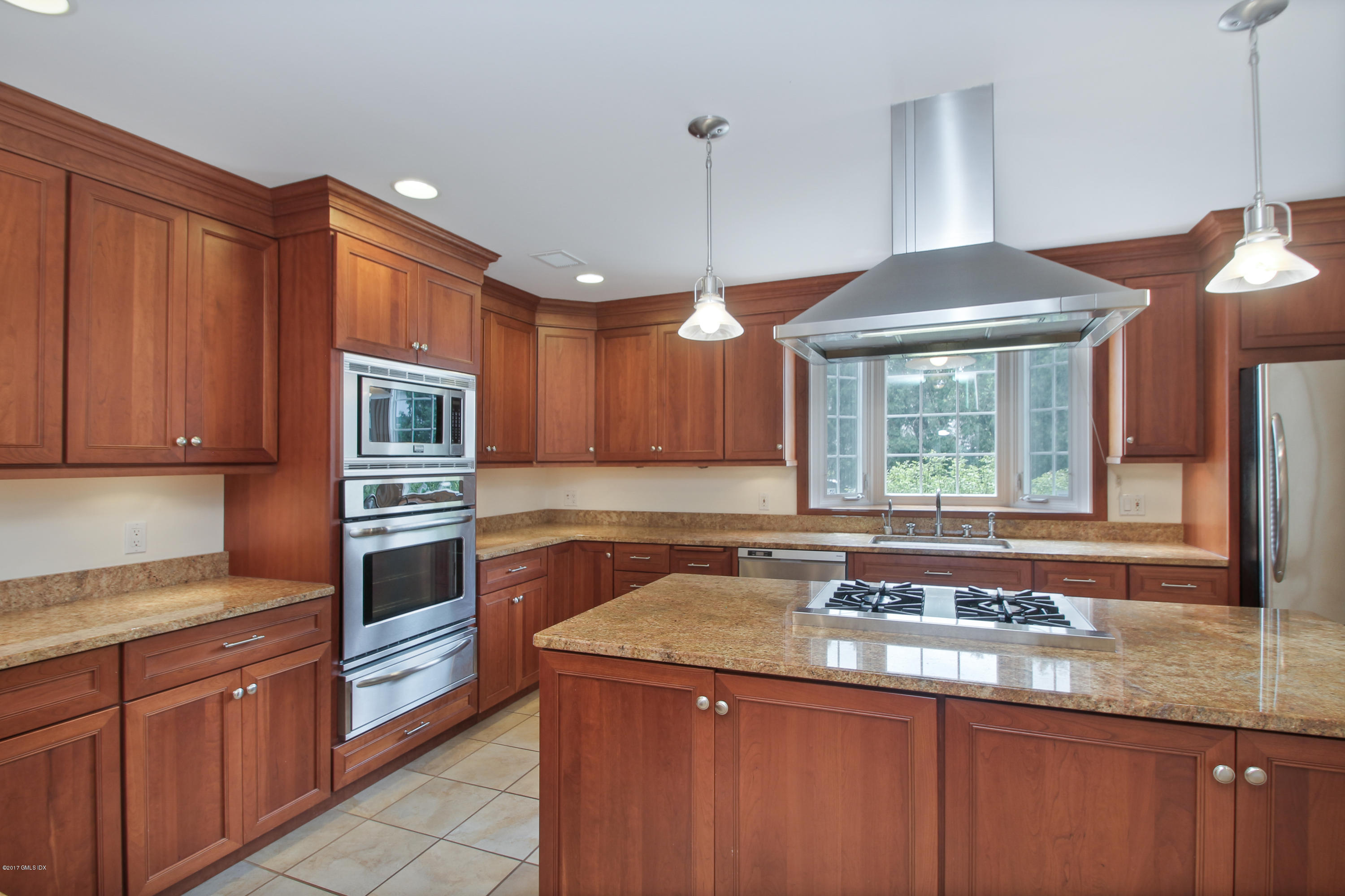 24 Decatur Street, Unit 2 Cos Cob, CT 06807 - Photo 6 of 19 a kitchen with granite countertop a sink a counter top space and cabinets