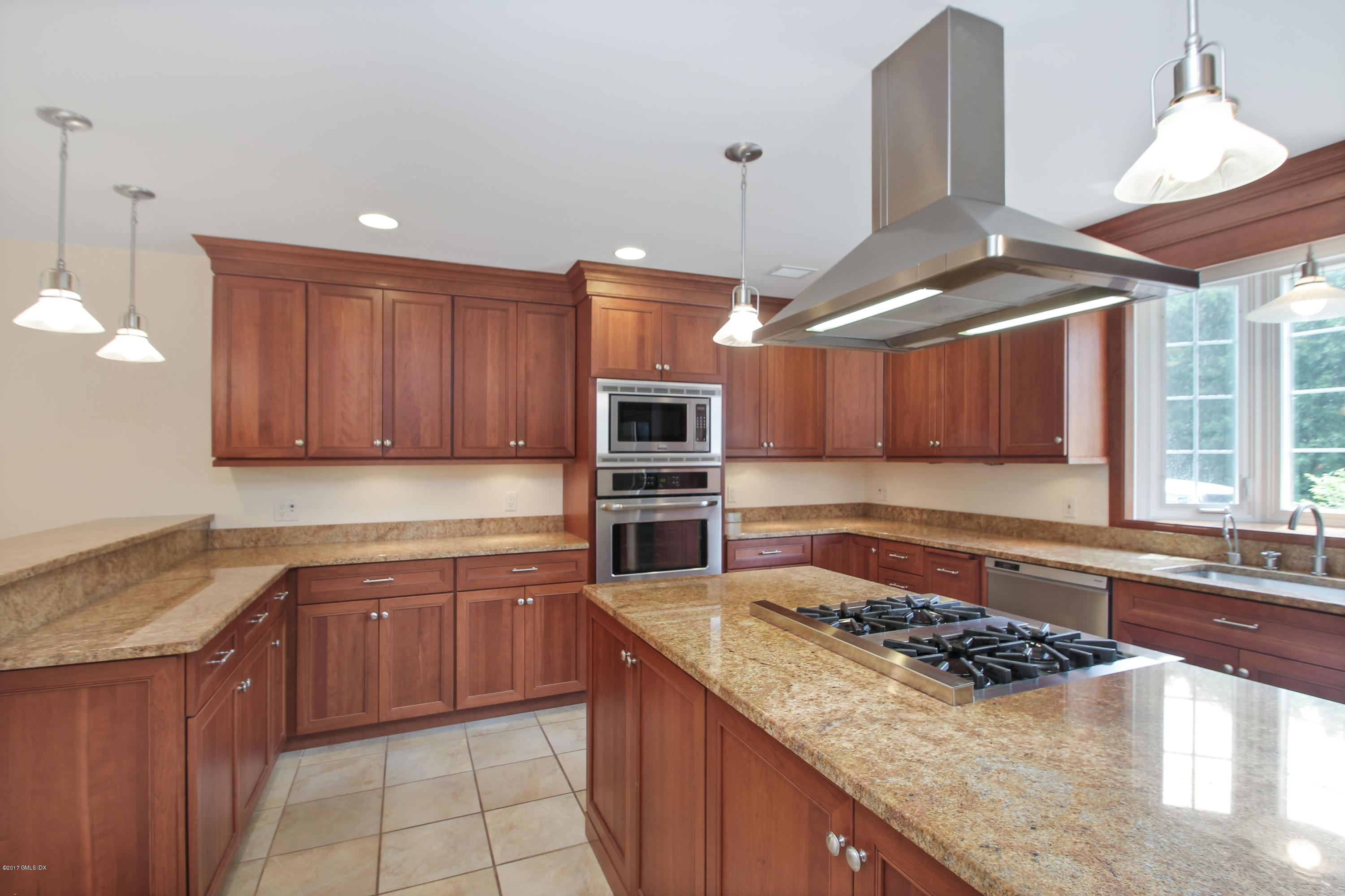 24 Decatur Street, Unit 2 Cos Cob, CT 06807 - Photo 7 of 19 a kitchen with stainless steel appliances granite countertop a stove a sink and a microwave