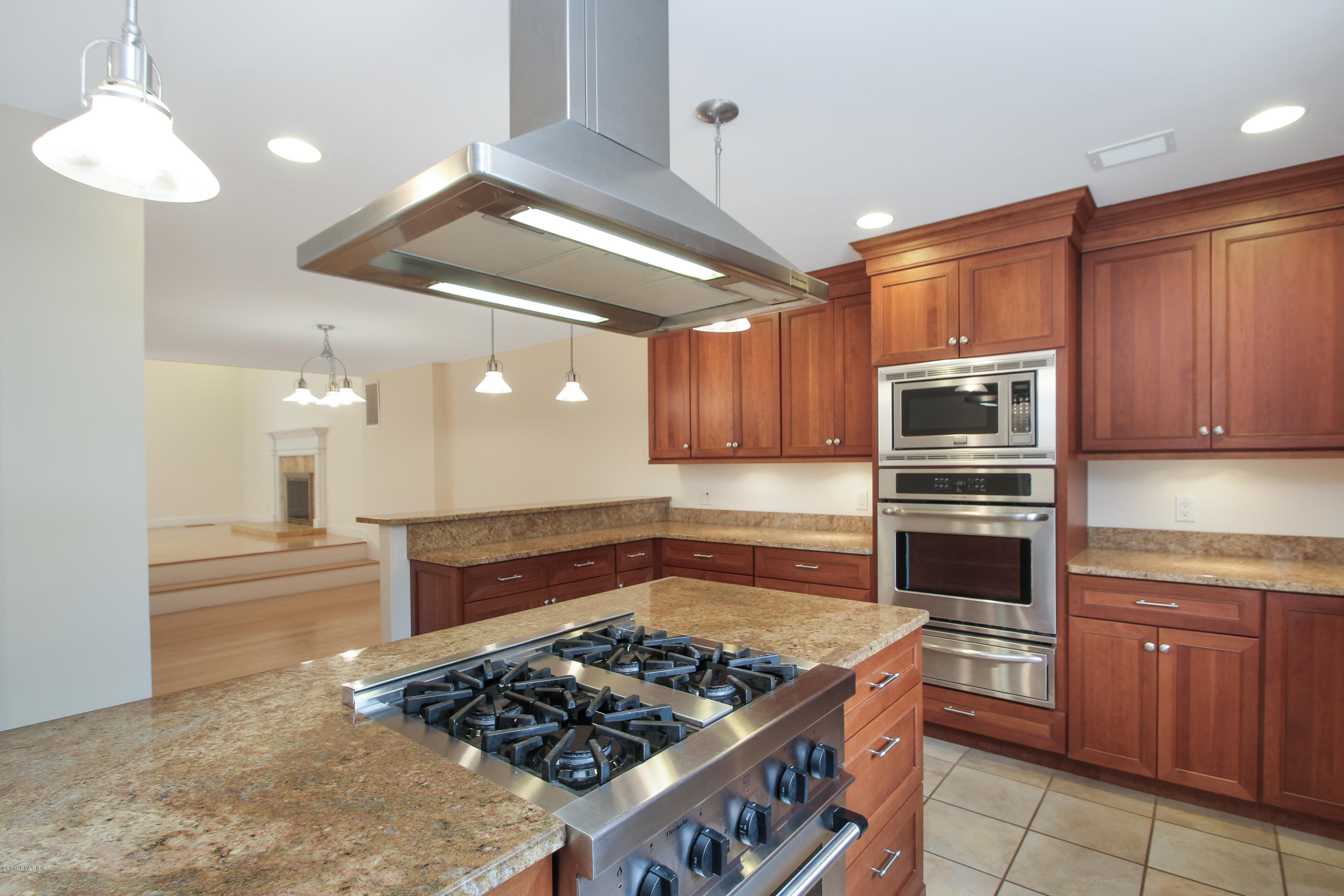 24 Decatur Street, Unit 2 Cos Cob, CT 06807 - Photo 8 of 19 a kitchen with stainless steel appliances granite countertop a stove refrigerator and cabinets