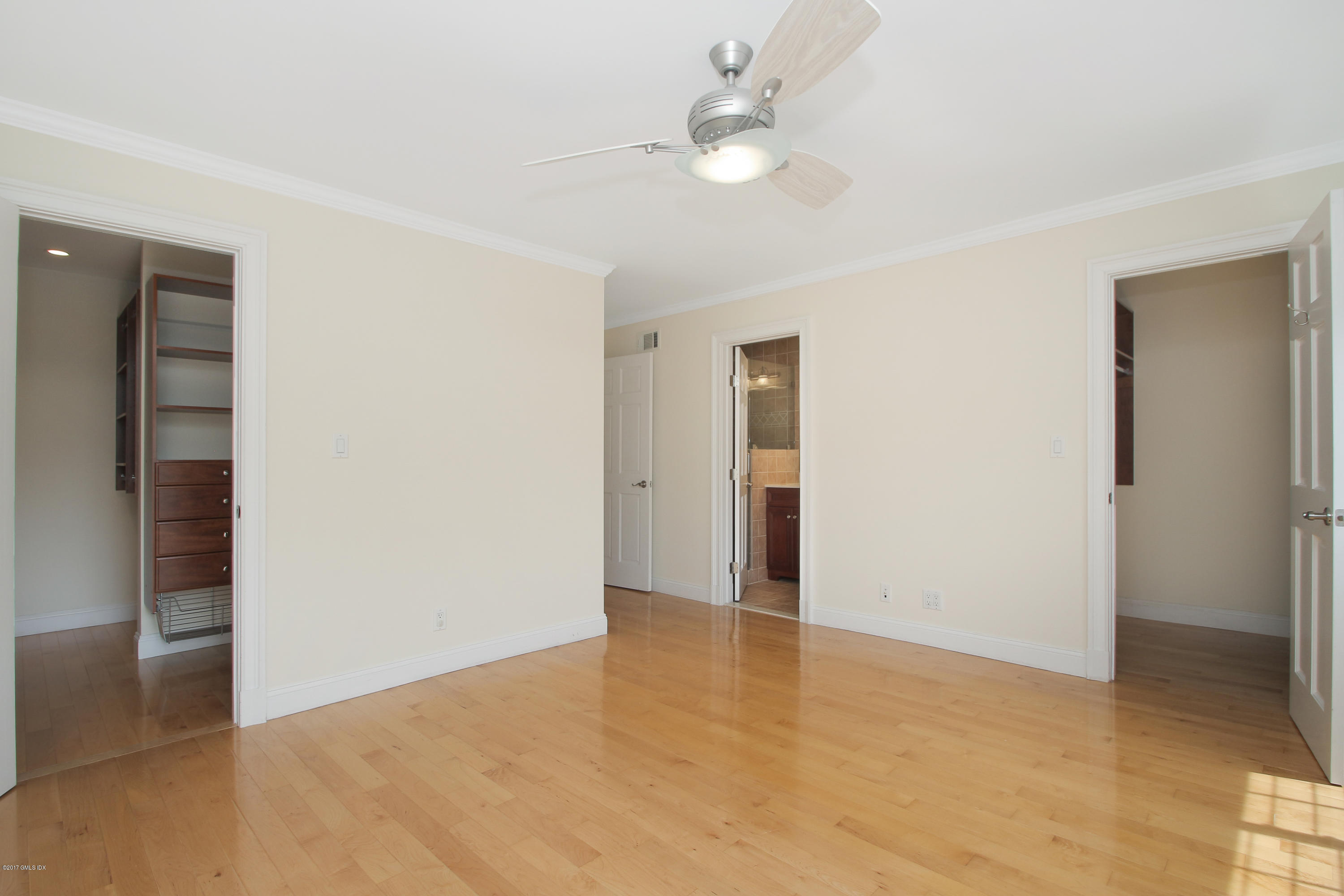 24 Decatur Street, Unit 2 Cos Cob, CT 06807 - Photo 10 of 19 a view of an empty room with a chandelier fan