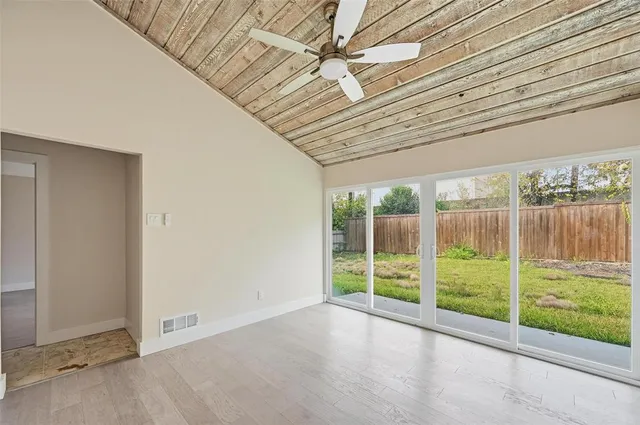 a view of a room with wooden walls