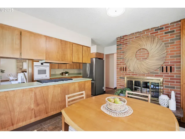 a kitchen with stainless steel appliances granite countertop a sink and a stove