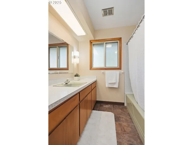 a bathroom with a sink and a bathtub