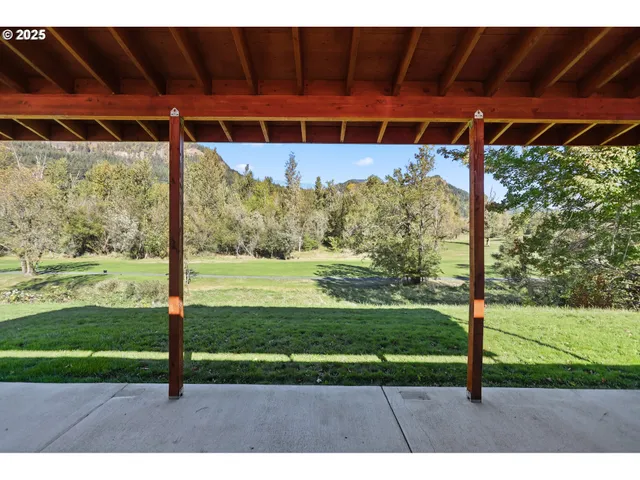 a backyard of a house with a yard and garage