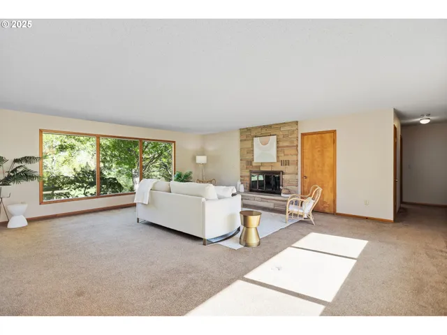 a living room with furniture and a table