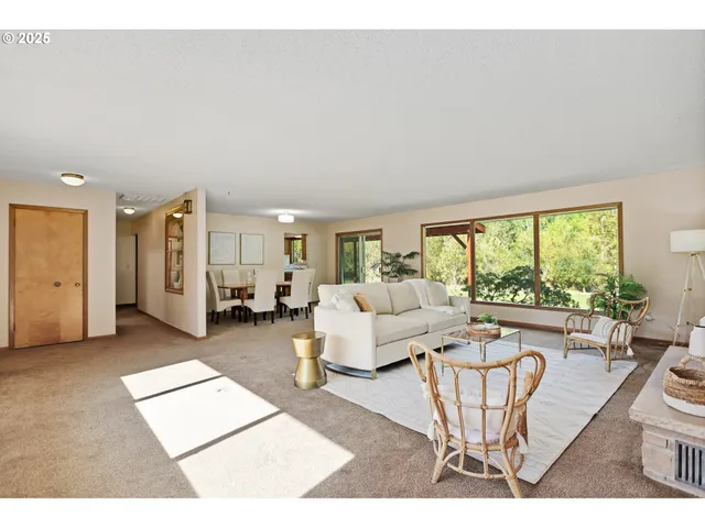 a living room with furniture and a table