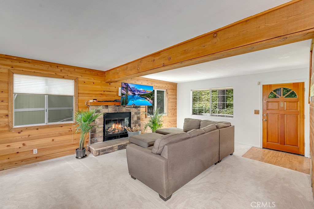 318 Old Toll Road Lake Arrowhead, CA 92352 - Photo 8 of 44 a living room with furniture a fireplace and a floor to ceiling window