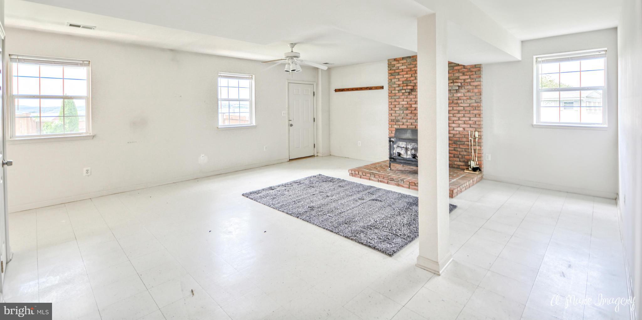 20844 Reno Monument Road Boonsboro, MD 21713 - Photo 24 of 30 Finished Basement with Wood Stove