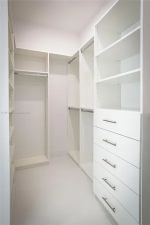 a view of an empty walk in closet