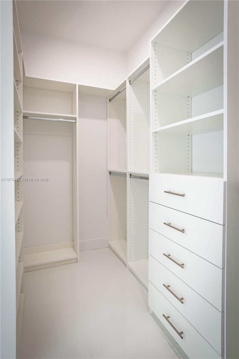 3107 Southwest 26th Street, Unit 3107 Miami, FL 33133 - Photo 16 of 26 a view of an empty walk in closet