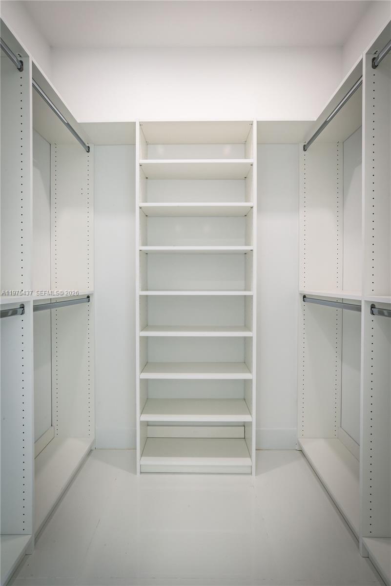 3107 Southwest 26th Street, Unit 3107 Miami, FL 33133 - Photo 17 of 26 a view of walk in closet with empty racks