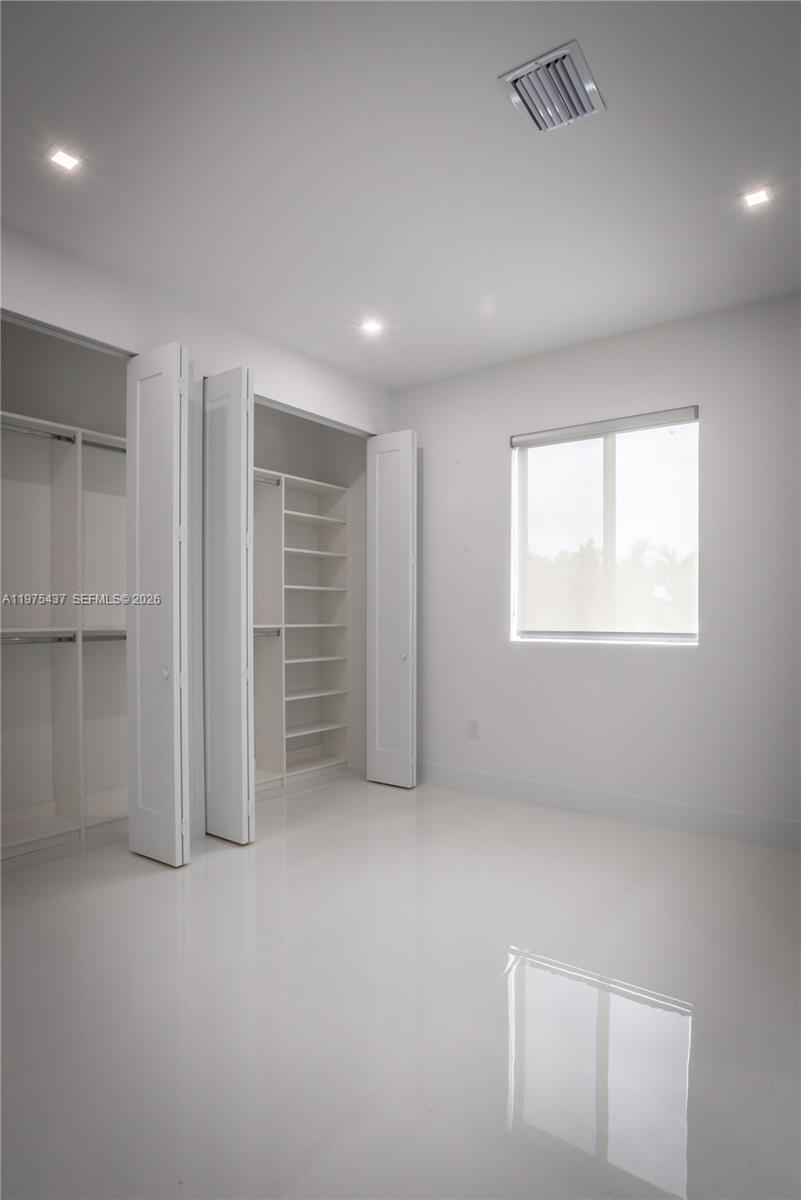 3107 Southwest 26th Street, Unit 3107 Miami, FL 33133 - Photo 18 of 26 a view of an empty room with a window