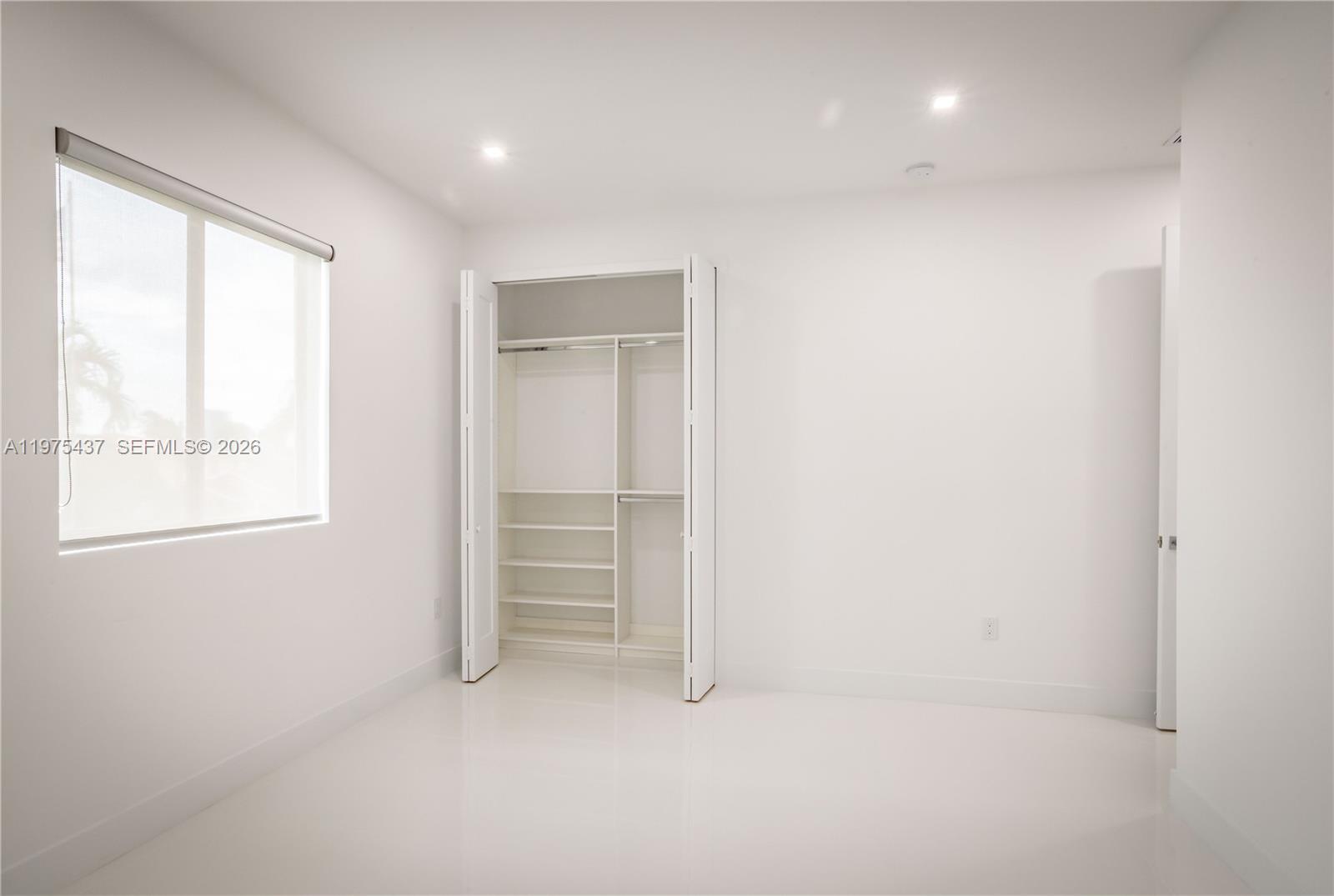 3107 Southwest 26th Street, Unit 3107 Miami, FL 33133 - Photo 21 of 26 an empty room with windows and closet