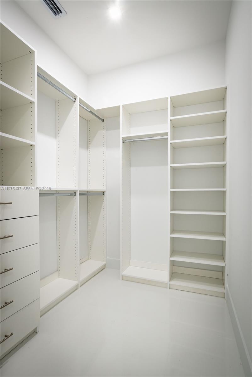 3107 Southwest 26th Street, Unit 3107 Miami, FL 33133 - Photo 24 of 26 a view of walk in closet with empty racks