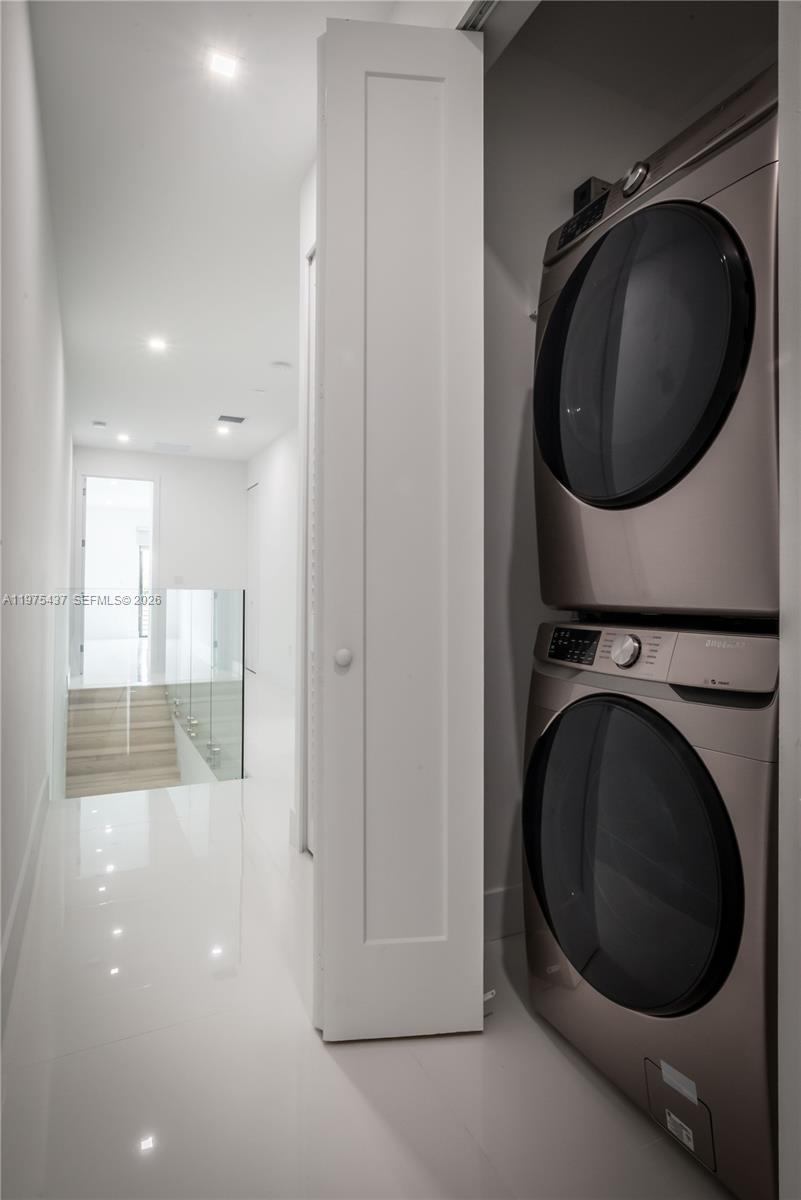 3107 Southwest 26th Street, Unit 3107 Miami, FL 33133 - Photo 26 of 26 a view of a hallway with washer and dryer