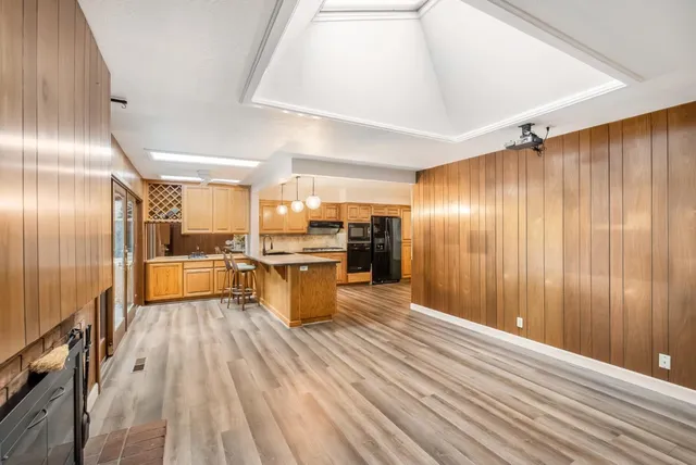 a view of a kitchen with wooden floor