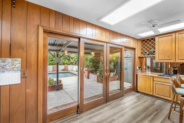 a view of a kitchen with a large window