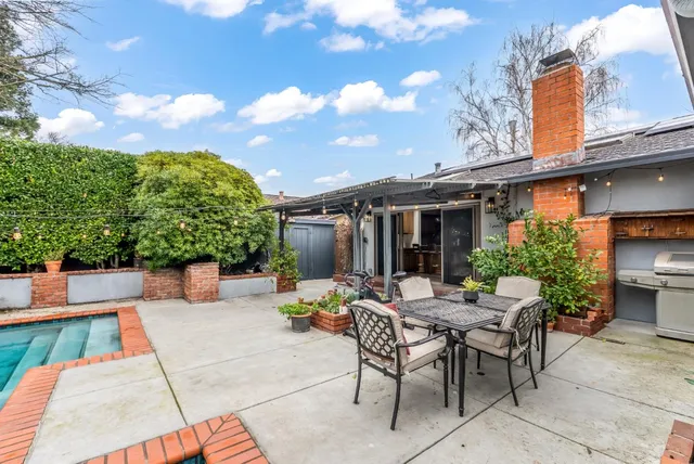 a view of swimming pool with a patio